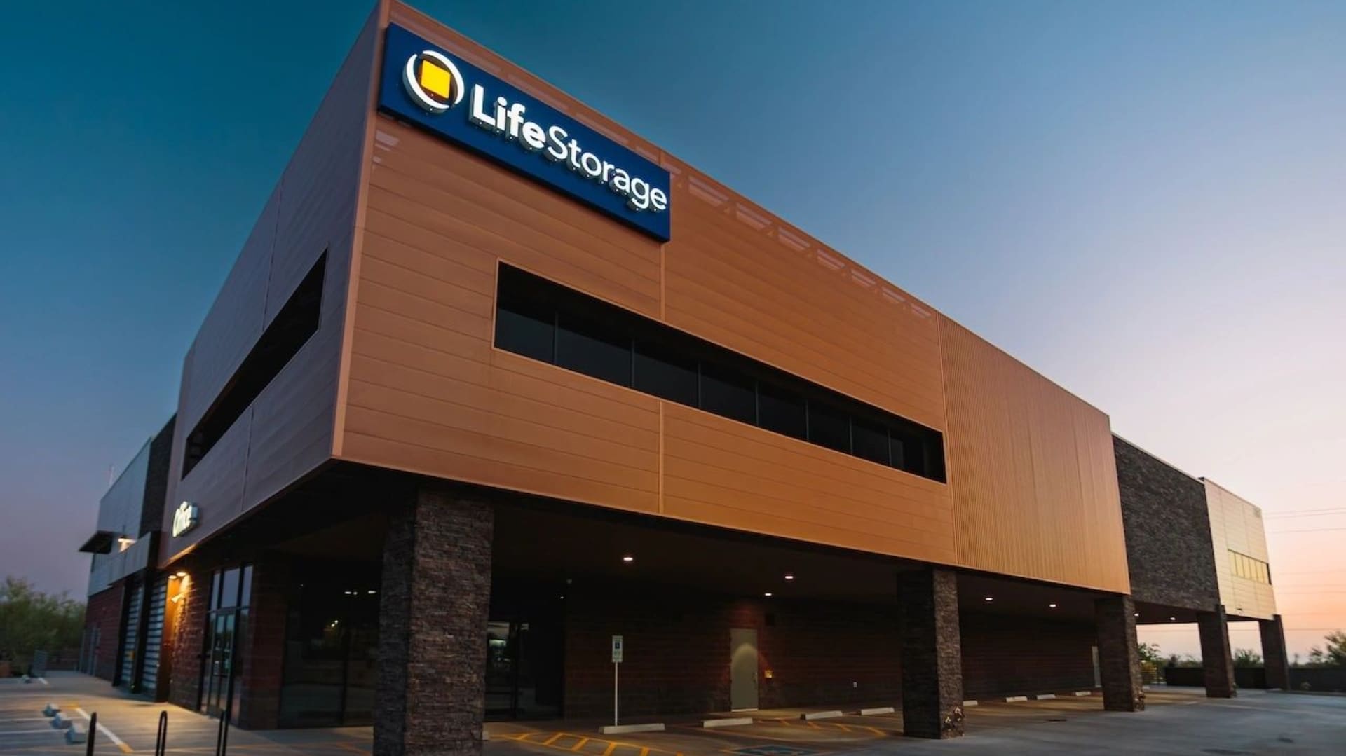 A large building with lots of windows and signage.