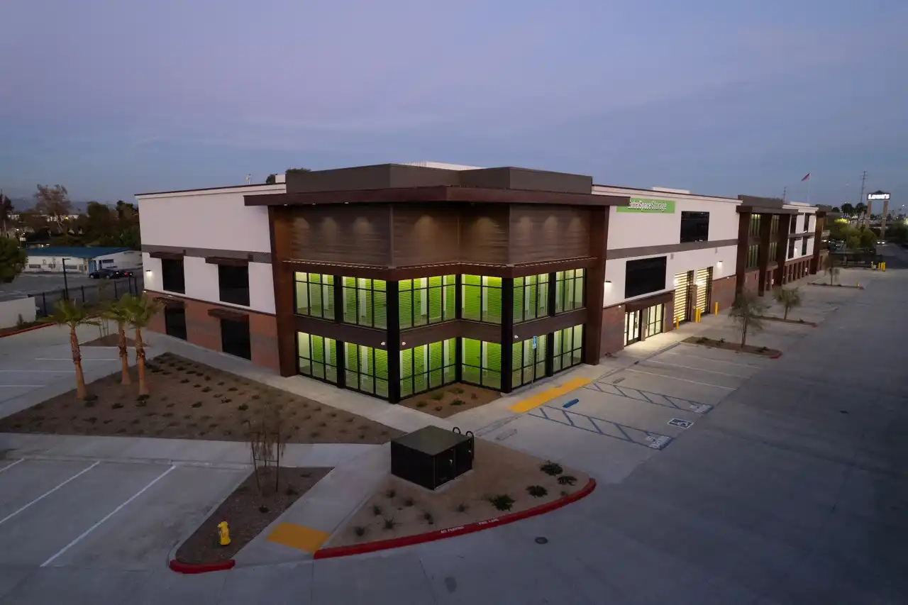 A large building with many windows and lights.