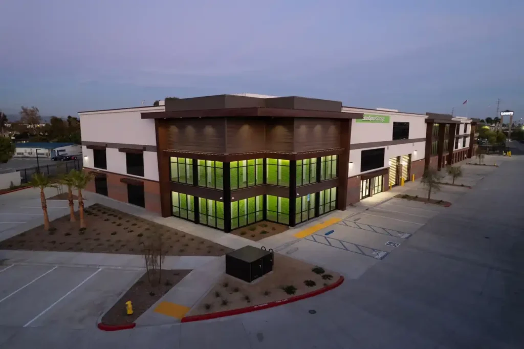 A large building with many windows and lights.