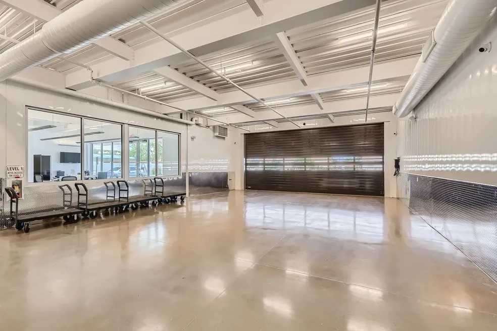 A large room with chairs and tables in it