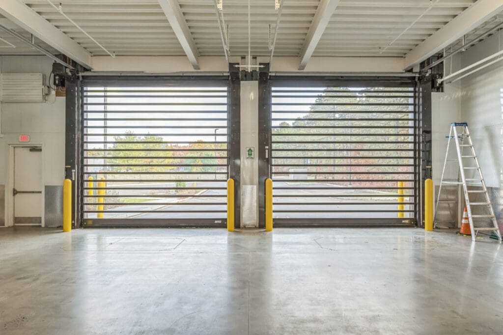 Photo of Interior Loading Bay with large rolling doors and open space