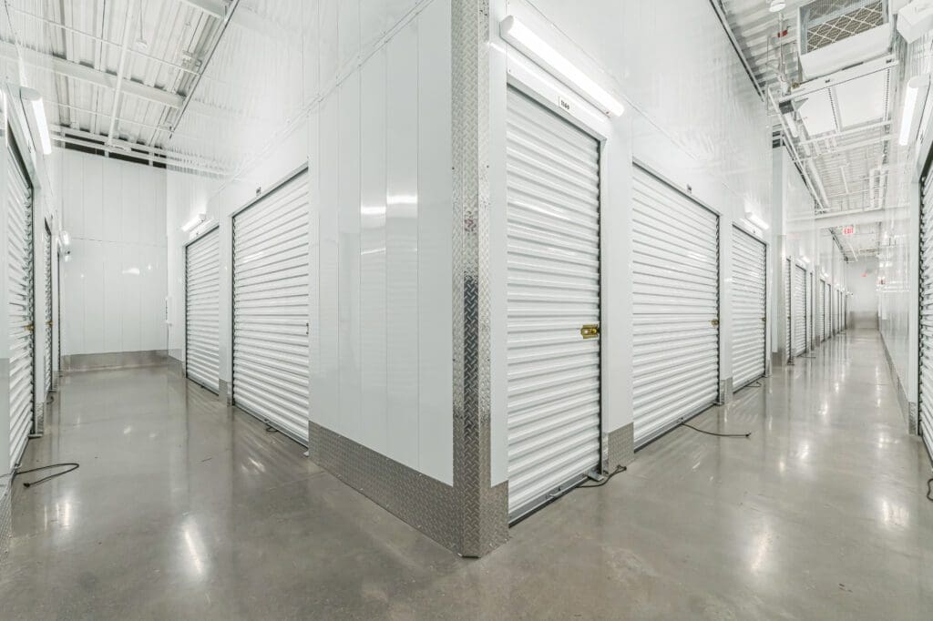 Toms River Self Storage Photo of Interior Storage Units. Light and bright hallway, white units.