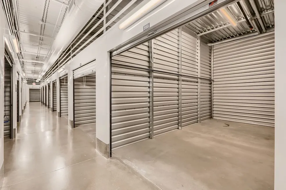 A large storage unit with many doors and windows.