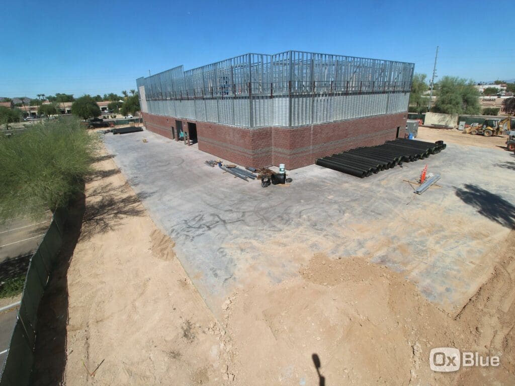 Photo of construction with steel and brick on building