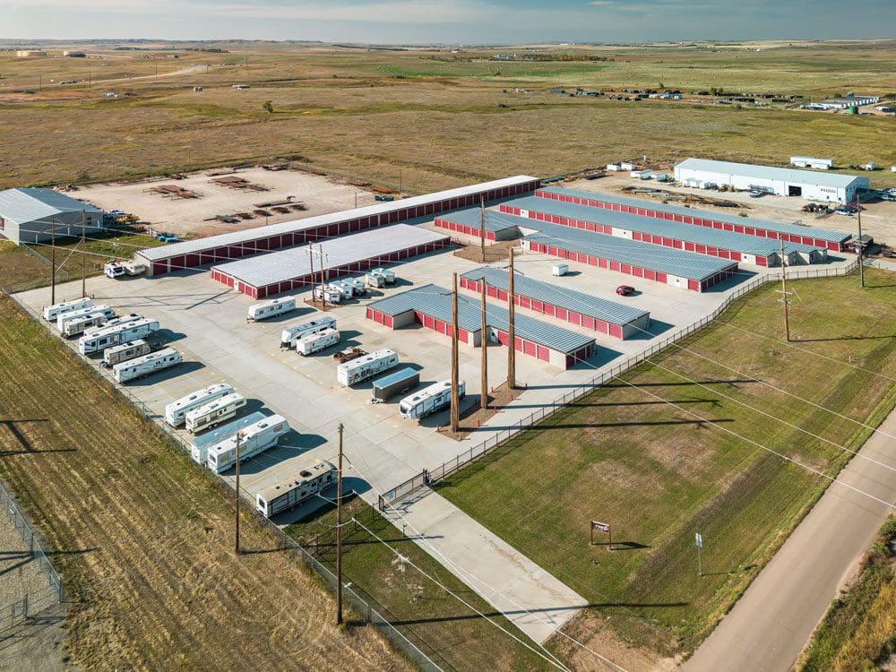 Daytime Aerial photo of Storage 85 in Watford City, ND showing RV parking and concrete driveways