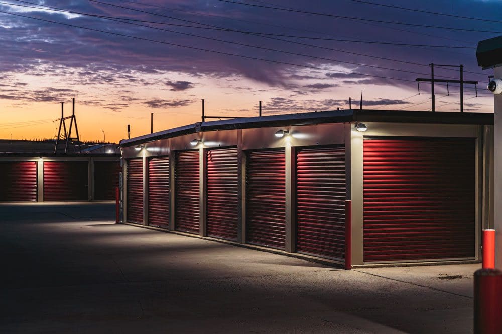 Night photo of exterior units at Storage 85 in Watford City ND