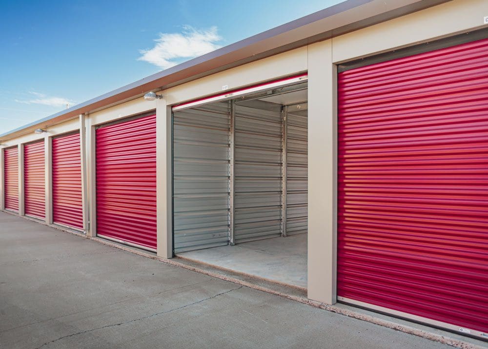 Daytime photo of storage unit with open door showing clean interior at Storage 85 in Watford City ND