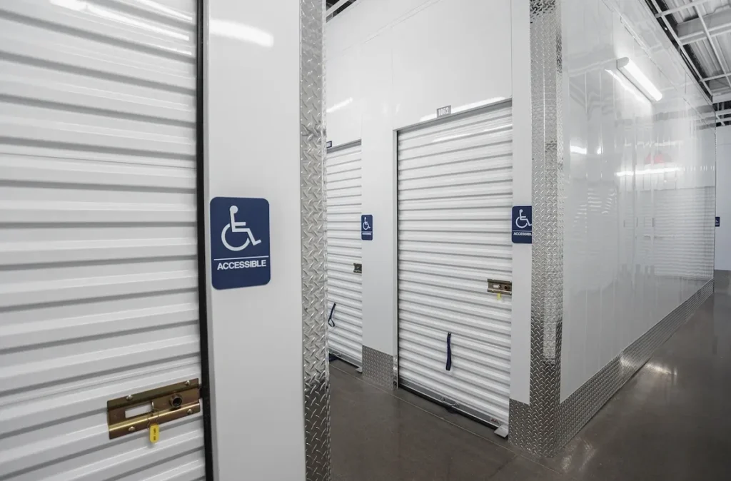 A room with several doors and signs on the wall.