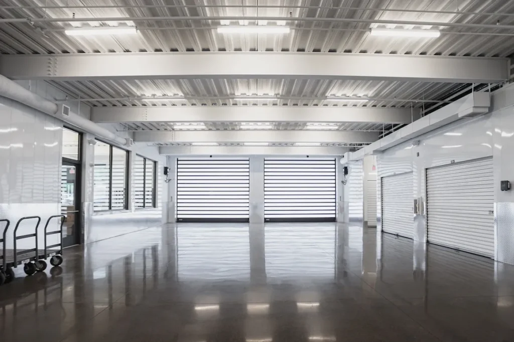 A large room with two doors and no windows.