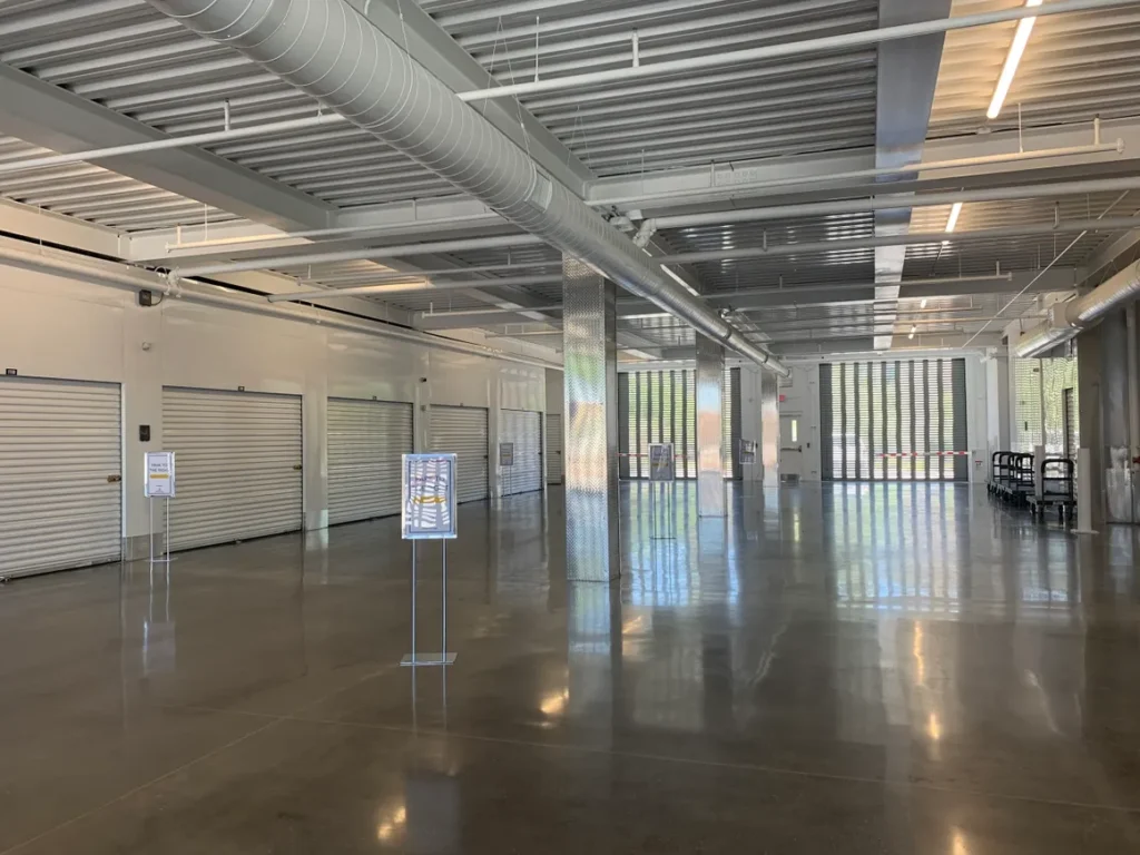 A large room with lots of windows and a lot of white walls.