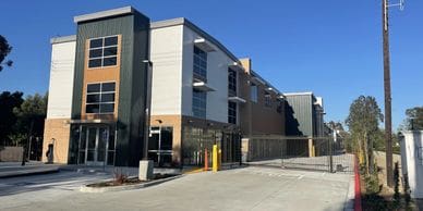 Photo of a multi-level building with green and brown accents