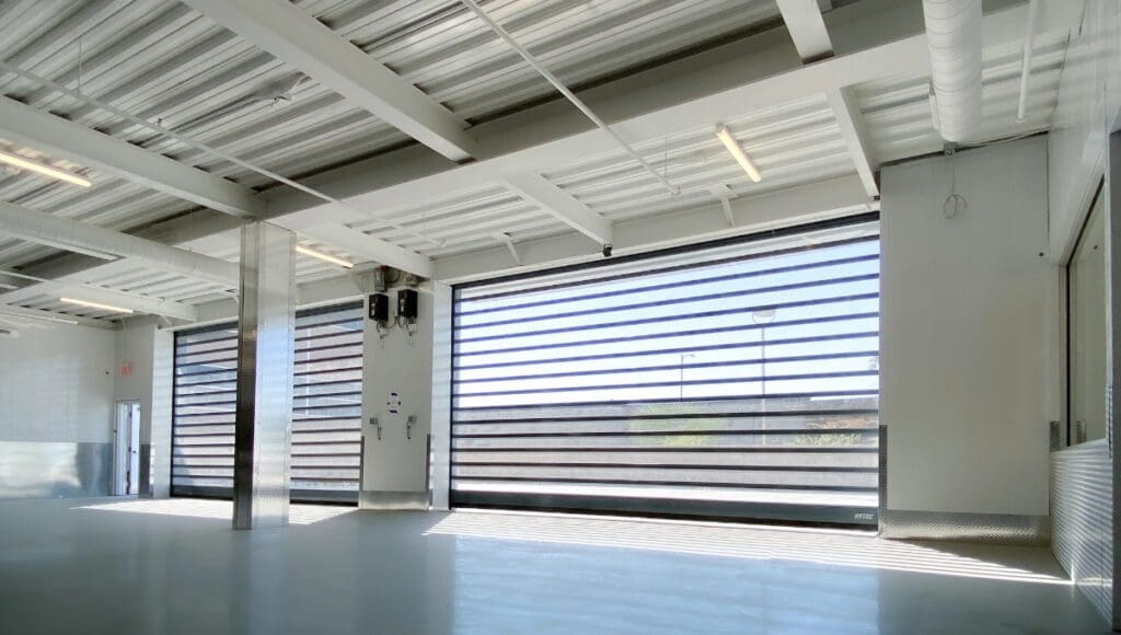 Photo of interior loading bay with automatic roll up doors for easy access
