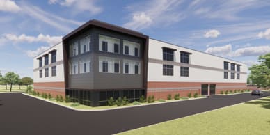 Multi level building with windows and brick accents