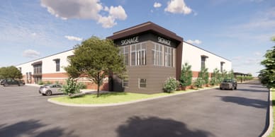 Multi level building with windows and brown accent