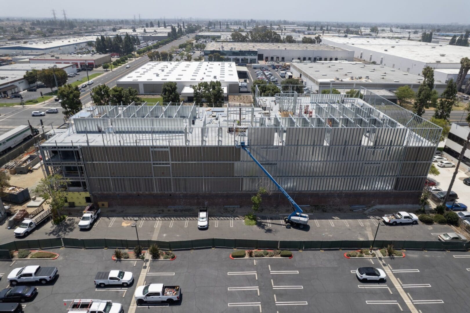 Aerial photo of a multi-level building with steel under construction