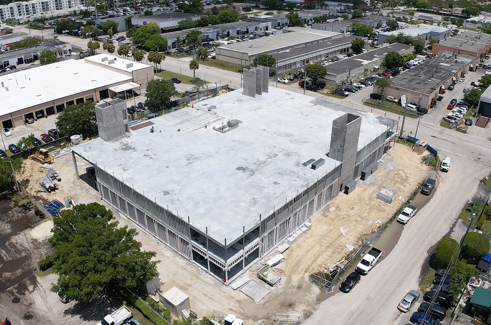 Aerial photo of a multi-level building with steel under construction
