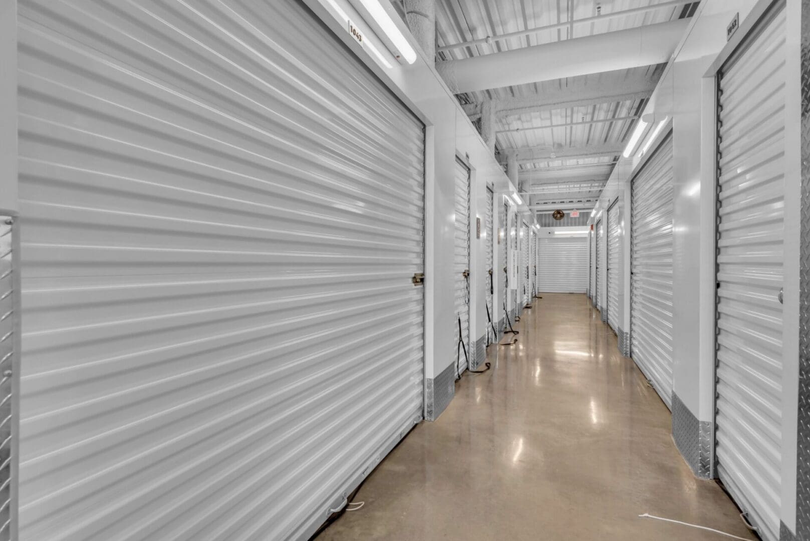 White storage units with polished concrete floors