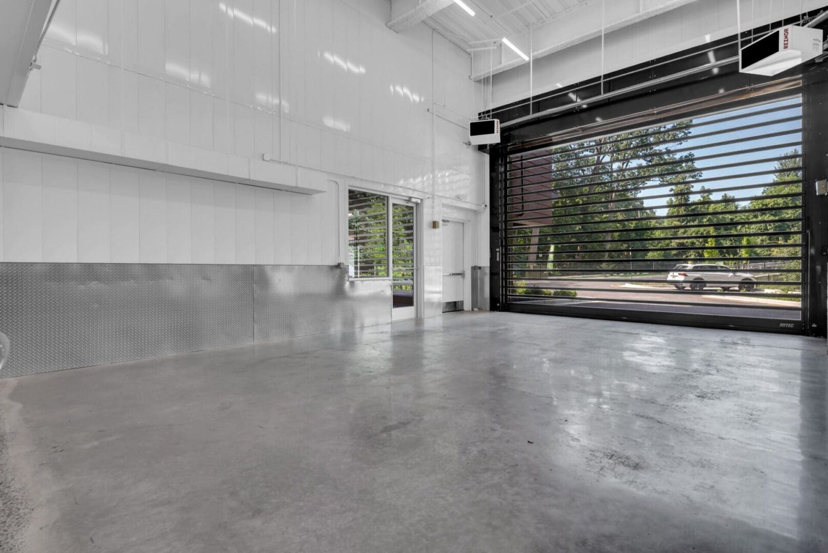 Interior storage loading bay with rolling door