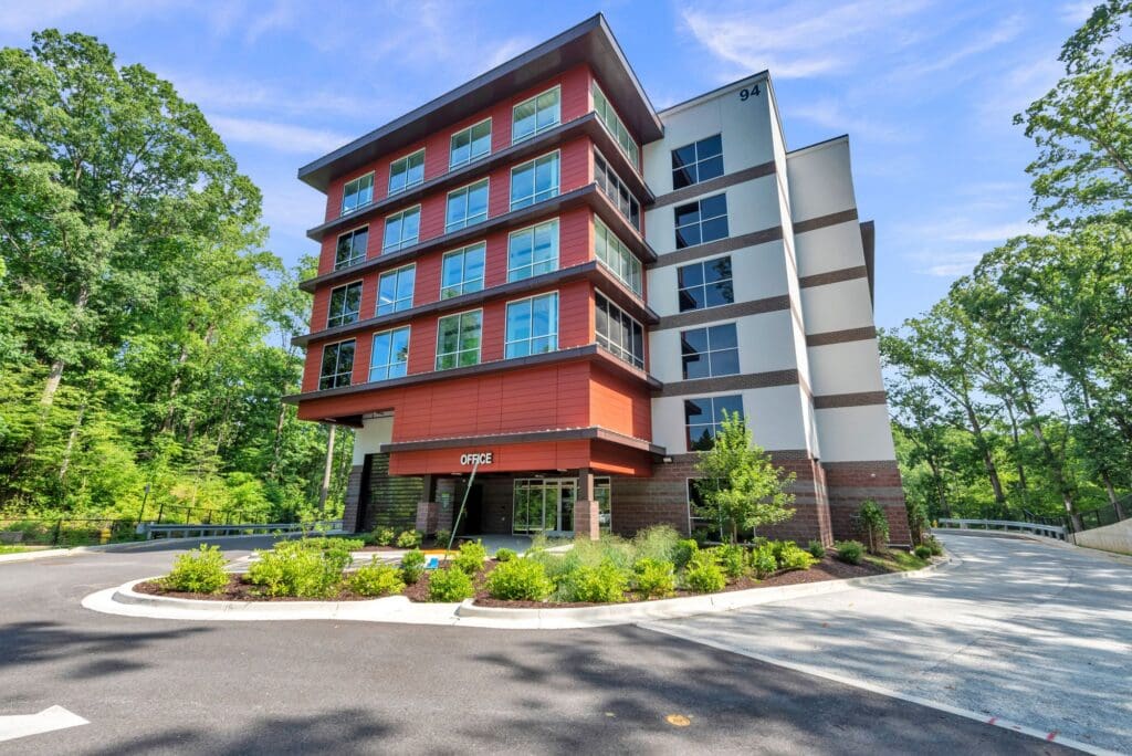 Multi-level storage building with windows and brick accents