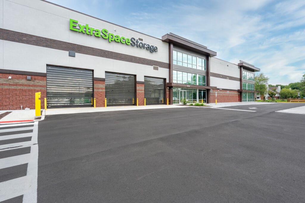 Storage building with three loading bay entrances and glass windows